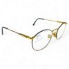 Side view of Safilo Elasta round eyeglasses, showing gold stainless steel temples with tortoiseshell accents.