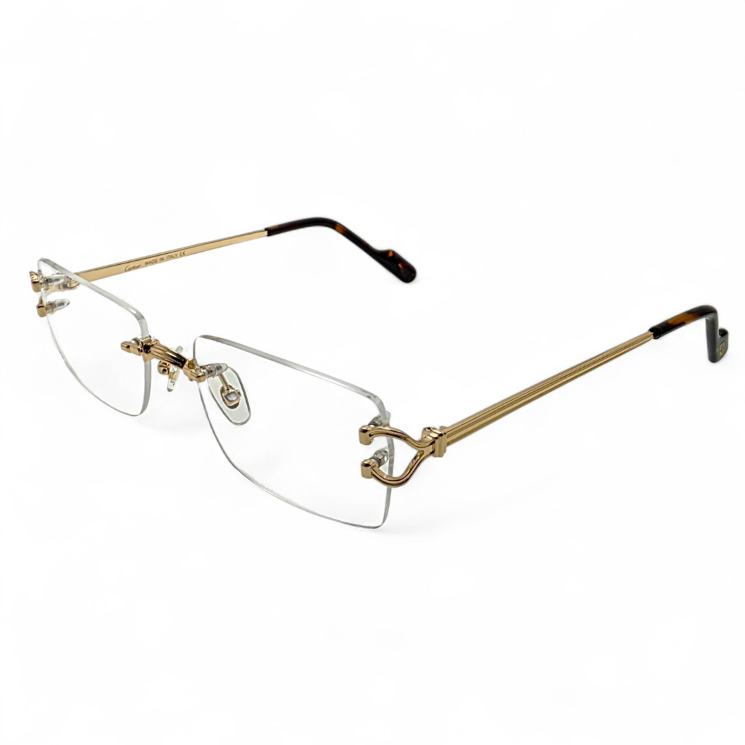 side view of golden C de Cartier